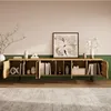 A modern TV stand with open shelves and curved wooden doors, decorated with books and decorative objects, in a living room setting. Voir les images du produit
