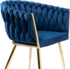 A close-up view of a blue velvet chair with gold legs. Náhled obrázku produktu