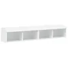 A white, wall-mounted TV cabinet with four open compartments. Produktbild-Vorschau
