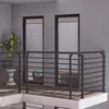 A modern balcony or loft railing system with a dark gray metal finish. Produktbild-Vorschau