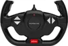 A black remote control steering wheel for a Porsche toy car. Podgląd zdjęcia produktu