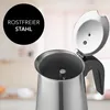 A close-up view of a stainless steel coffee maker with its lid open. Produktbild-Vorschau