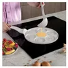 A person is pouring pancake batter into a multi-shaped pancake pan on a stovetop. Náhľad obrázku produktu