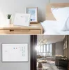 A collage showing a smart thermostat on a nightstand and another smart thermostat mounted on a wall in a living room. Podgląd zdjęcia produktu
