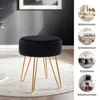 A black velvet ottoman with gold metal legs is shown in a room, with smaller circular images on the right showing the ottoman in different room settings. Podgląd zdjęcia produktu