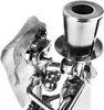 A close-up view of a wedding cake topper made from metal parts, depicting a bride and groom. Anteprima dell’immagine prodotto