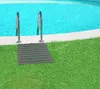A gray slatted mat is placed on green artificial grass next to the edge of a swimming pool with blue water. Produktbild-Vorschau