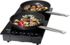 A double induction cooktop with two pans filled with food. Podgląd zdjęcia produktu
