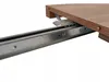 A close-up view of a table extension mechanism, showing a wooden tabletop and metal sliding rails. Náhľad obrázku produktu