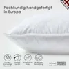 A close-up of a white pillow with marketing text and icons. Produktbild-Vorschau