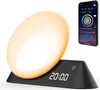 A smart alarm clock with a large illuminated display and a smartphone showing its app interface. Náhľad obrázku produktu