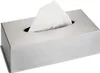 A stainless steel tissue box dispenser with white tissues emerging from the top. Anteprima dell’immagine prodotto