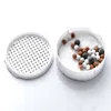 A disassembled shower head filter with its components laid out on a white background. Produktbild-Vorschau