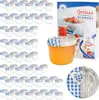A collection of small glass jars with lids, a larger jar of jam, and a decorative plate, arranged on a white background. Voir les images du produit