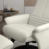 A close-up view of a cream-colored recliner chair and ottoman, with a small side table holding a glass of water, a book, and glasses. Produktbild-Vorschau