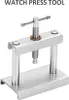 A watch press tool is shown against a white background. Náhled obrázku produktu