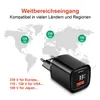 A world map graphic showing voltage compatibility for a black power adapter. Produktbild-Vorschau