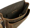 Close-up view of the interior of a brown leather bag, showing pockets and a zipper. Podgląd zdjęcia produktu