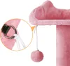 Close-up view of a pink cat tree, showing a dangling toy and a detail of the attachment mechanism. Produktbild-Vorschau