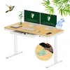A standing desk with dual monitors, a phone charging wirelessly, and a hummingbird flying nearby, with bamboo leaves in the background. Produktbild-Vorschau