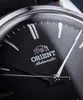 Close-up of a black watch face with silver hands and hour markers. Produktbild-Vorschau