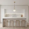 A modern kitchen with a marble island and pendant light. Produktbild-Vorschau
