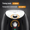 Close-up of the top and front of a black air fryer, showing control knobs and text overlays. Produktbild-Vorschau