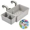 A grey plastic storage basket with hooks for hanging on the side of a pool or hot tub, shown with a smaller divided compartment and a larger compartment with drainage holes. A smaller inset image shows the basket in use, holding drinks and pool toys. Produktbild-Vorschau