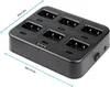 A black multi-charger for walkie-talkies is shown from a slightly elevated diagonal angle against a white background. Dimensions are indicated by blue lines and text. Anteprima dell’immagine prodotto