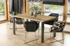 A dining table and chairs set in a modern dining room with large windows overlooking a garden. Podgląd zdjęcia produktu