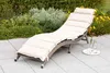 A lounge chair on a patio with plants in the background. Produktbild-Vorschau
