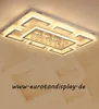 A modern rectangular LED ceiling light with crystal accents, mounted on a white ceiling with a patterned background. Produktbild-Vorschau