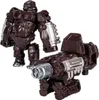 A toy robot in gorilla form and a separate weapon accessory, both in brown and silver. Produktbild-Vorschau