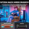 A young person playing a guitar while sitting in a gaming chair, with shelves of gaming accessories and LED lighting in the background. Two comparison graphics are shown at the bottom. Náhled obrázku produktu