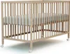 A wooden baby crib with a mattress inside, shown from a slightly elevated side angle. Anteprima dell’immagine prodotto