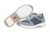 A pair of blue women's sneakers, one shown from the side and the other from underneath. Produktbild-Vorschau