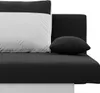 A close-up view of a black and white sofa with a pillow. Produktbild-Vorschau