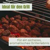 Close-up of glowing lava rocks on a grill, with metal grates visible. Produktbild-Vorschau