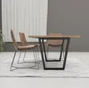 A dining table and chairs set on a rug in a room with white curtains. Anteprima dell’immagine prodotto