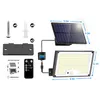 A flat lay of a solar flood light kit, including the light, solar panel, remote, mounting bracket, screws, wall plugs, and user manual. Produktbild-Vorschau