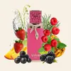 A pink perfume bottle surrounded by various fruits, flowers, and herbs. Voir les images du produit