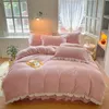 A neatly made bed with pink bedding and pillows in a room with natural light. Produktbild-Vorschau