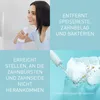 A collage of images showing a woman using a water flosser and a close-up of the water flosser cleaning teeth, with marketing text. Anteprima dell’immagine prodotto