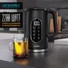 A black electric kettle with a digital display and a glass mug of tea on a kitchen counter. Produktbild-Vorschau