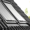 Two skylight windows with roller blinds installed on a tiled roof. Produktbild-Vorschau