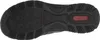 The bottom view of a black shoe sole with a red logo. Voir les images du produit