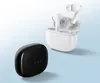 Two charging cases for wireless earbuds, one black and one white, are displayed against a light blue and white background. The white case is open, showing the earbuds inside. Náhled obrázku produktu