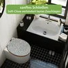 A bathroom scene featuring a toilet with a decorative seat and a sink. Produktbild-Vorschau
