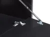 Close-up of a black cabinet with metal hinges and a support arm. Podgląd zdjęcia produktu