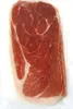 A close-up, top-down view of thinly sliced prosciutto ham, packaged in clear plastic. Produktbild-Vorschau